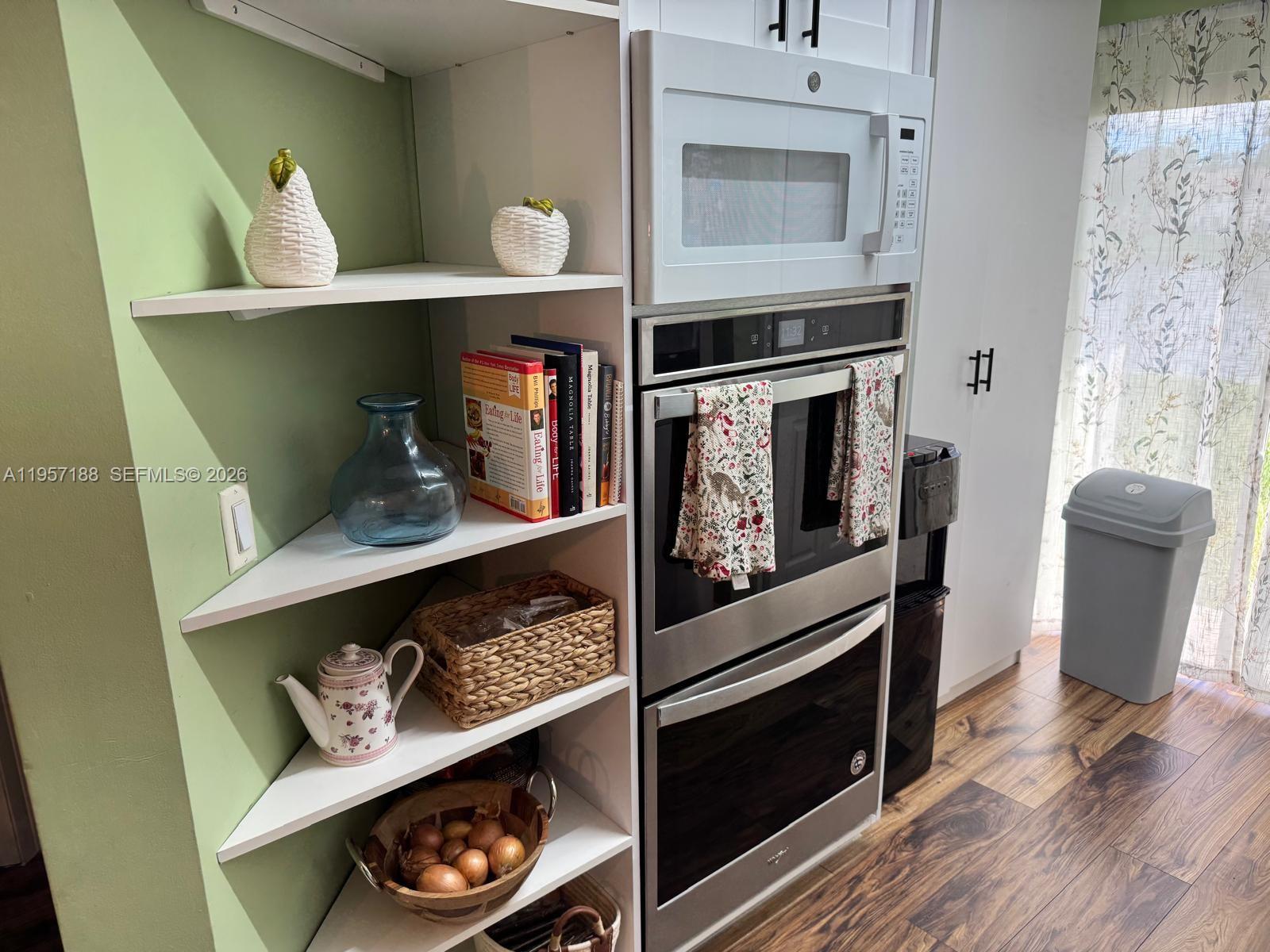 2931 Southeast 12th Road, Unit 10555 Homestead, FL 33035 - Photo 7 of 21 a kitchen with a stove and cabinets