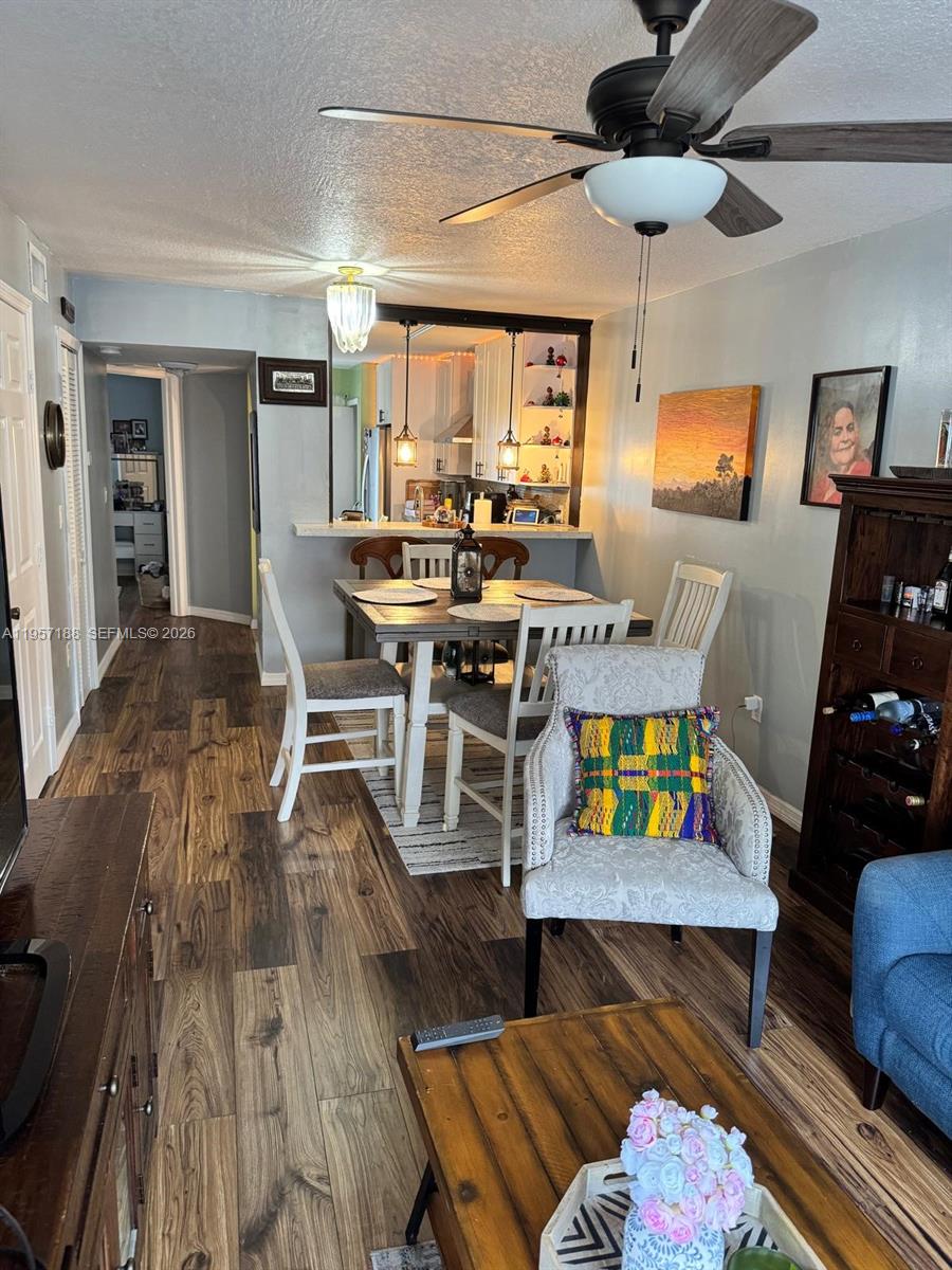2931 Southeast 12th Road, Unit 10555 Homestead, FL 33035 - Photo 8 of 21 a living room with furniture and a wooden floor