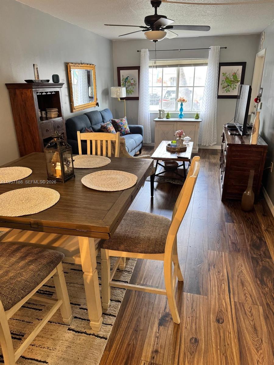 2931 Southeast 12th Road, Unit 10555 Homestead, FL 33035 - Photo 9 of 21 a living room with furniture and a wooden floor