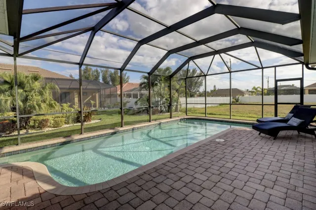 a view of a swimming pool with an outdoor seating