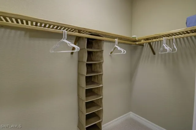 a bathroom with a granite countertop sink toilet and mirror