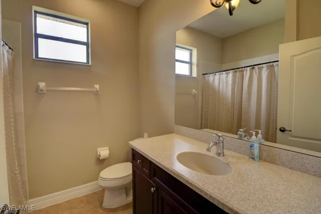 a bedroom with a bed and a table