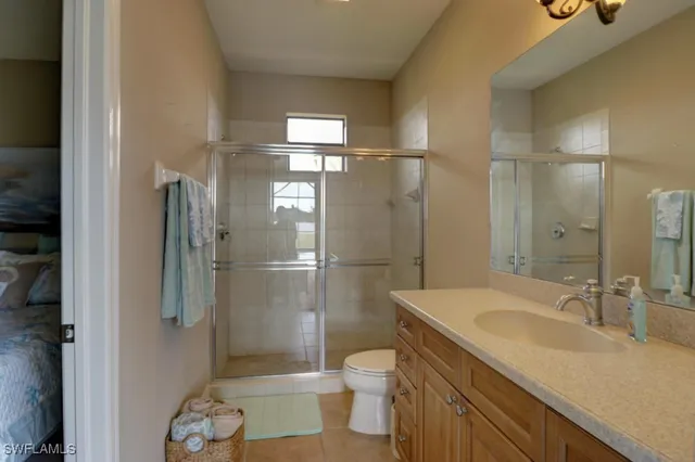 a view of a lake with boats and trees in the background