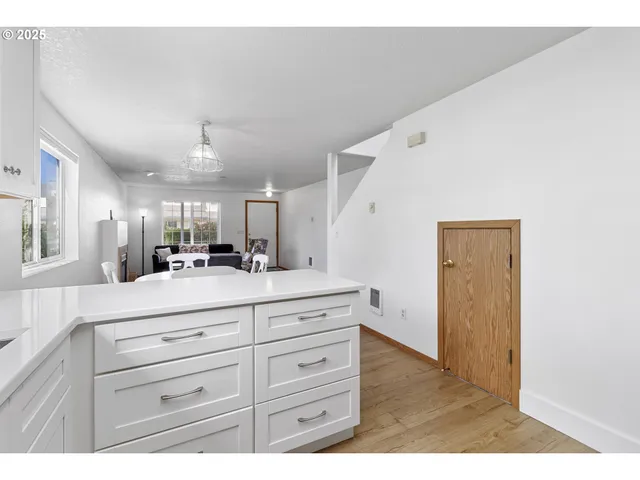 a view of a hallway view with wooden floor