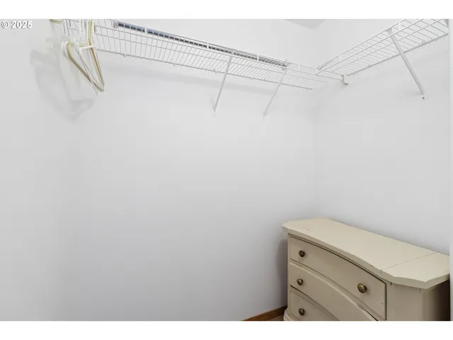 a bathroom with a shower and vanity