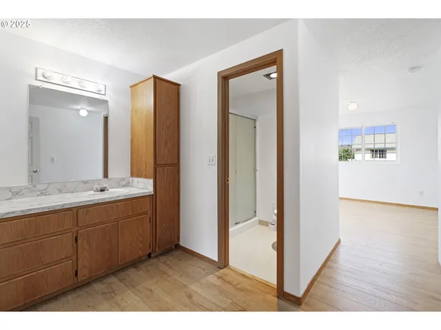 a bathroom with a double vanity sink and mirror