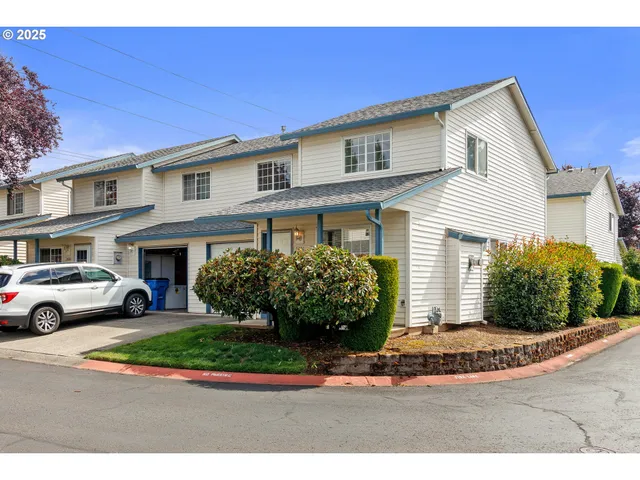 a view of street along with residential houses