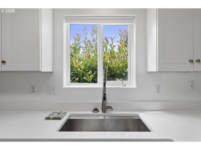 a bathroom with a bathtub and a window