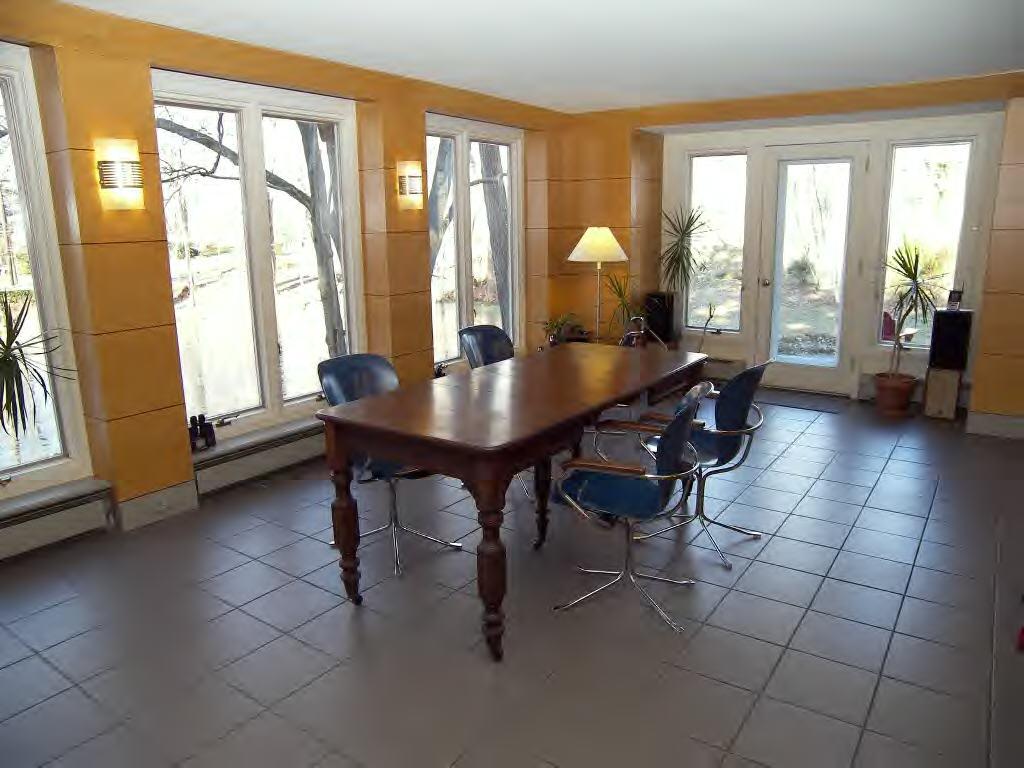 45 R Old Farm Road Darien, CT 06820 - Photo 8 of 16 a dining room with furniture and large windows