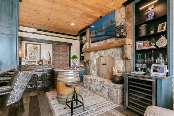 a living room with fireplace furniture and a flat screen tv