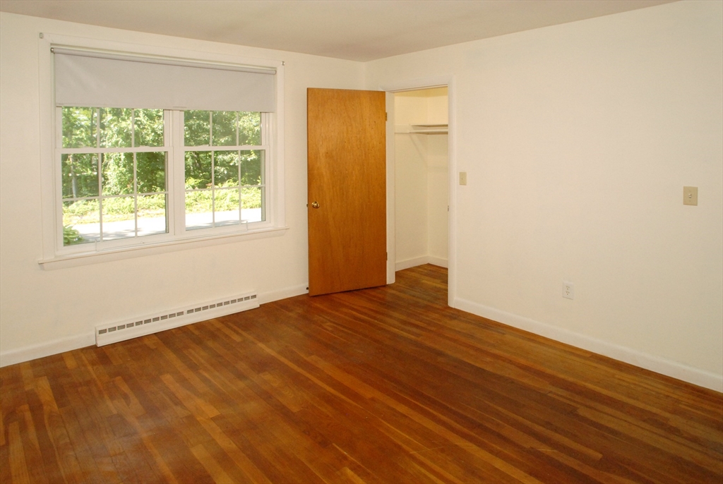 7 Howard Street Milford, MA 01757 - Photo 15 of 22 an empty room with wooden floor and windows
