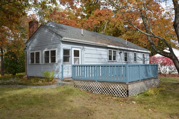 a front view of a house with a fence