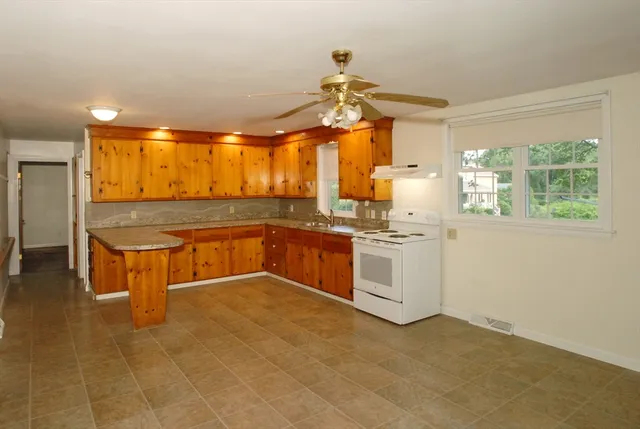 a kitchen with stainless steel appliances granite countertop a sink and cabinets