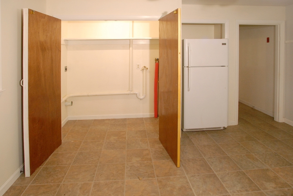 7 Howard Street Milford, MA 01757 - Photo 8 of 22 a view of a hallway with closet