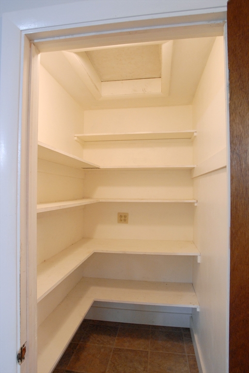 7 Howard Street Milford, MA 01757 - Photo 9 of 22 a view of walk in closet with empty racks