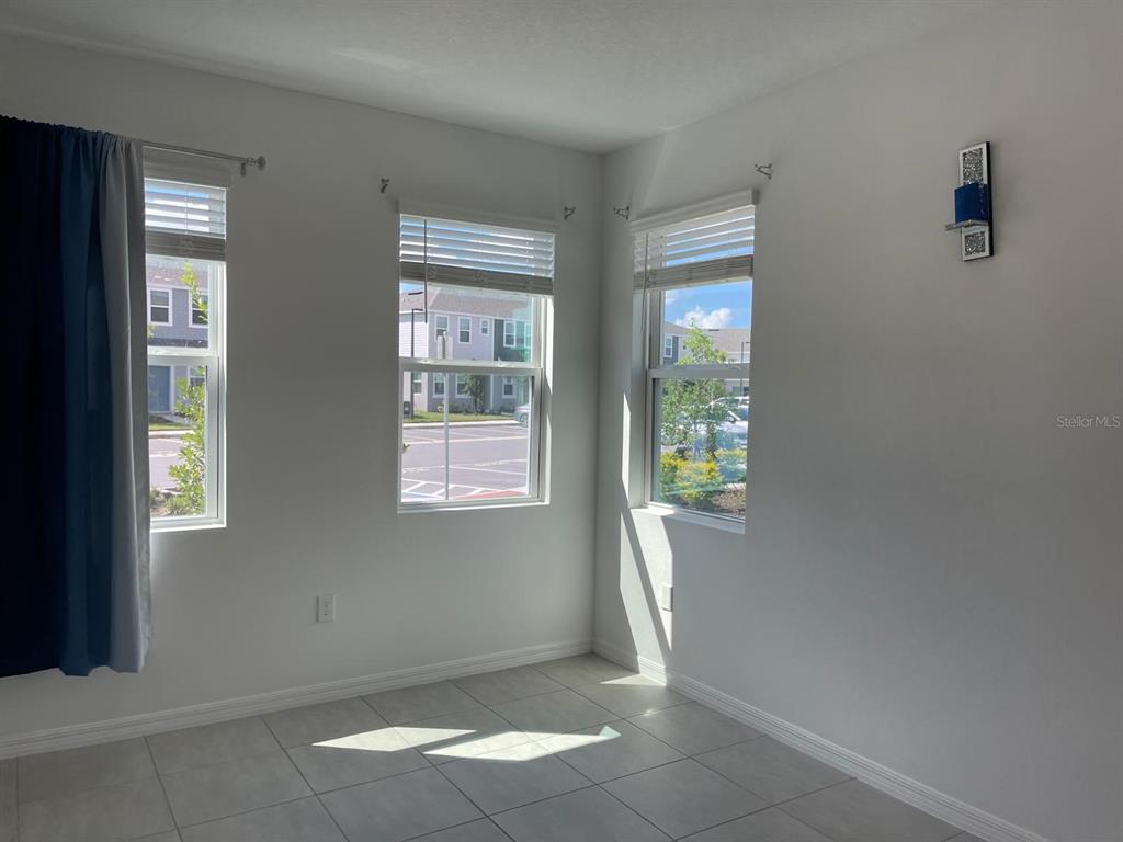 3335 Composition Street Kissimmee, FL 34758 - Photo 4 of 22 a view of an empty room with a window