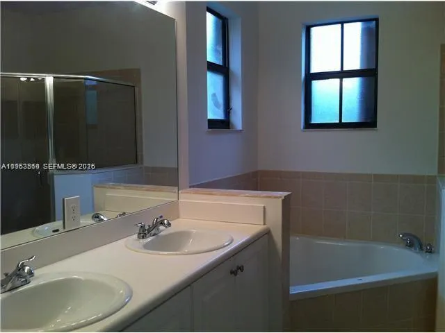 a bathroom with a sink and a bathtub