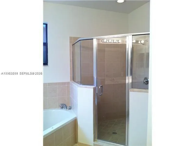 a bathroom with a bathtub and a sink