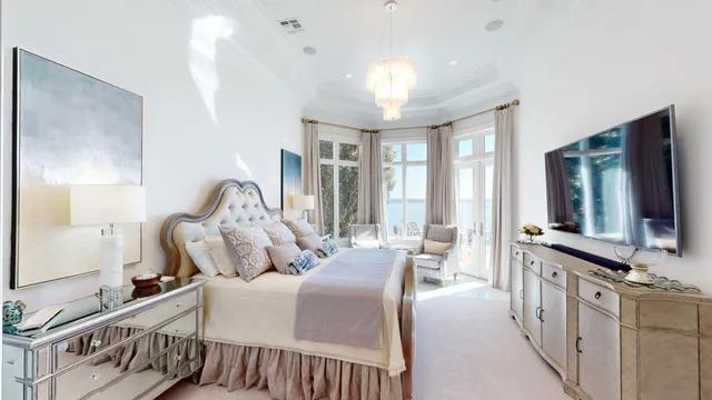 a bedroom with furniture and a flat screen tv