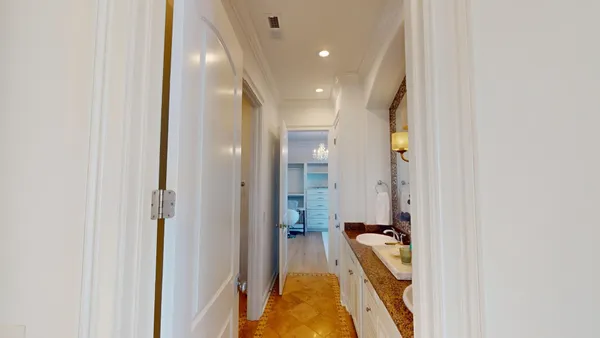a very nice looking room with a large window and chandelier