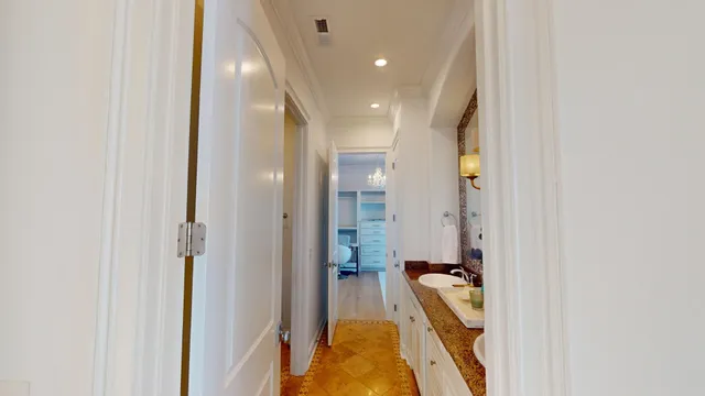 a very nice looking room with a large window and chandelier