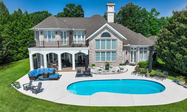 a view of house with outdoor space porch and outdoor seating