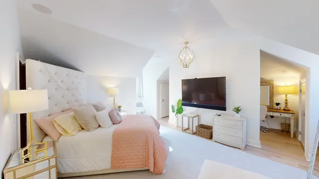 a view of a dining room with furniture and chandelier