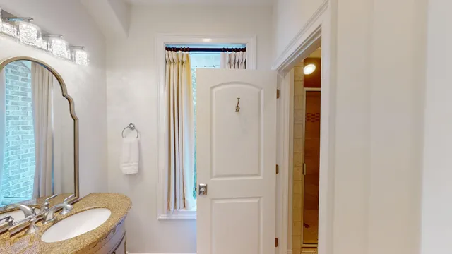 a backyard of a house with table and chairs