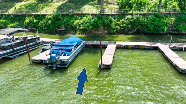a view of a house with a yard table and chairs