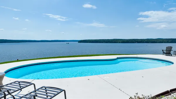 a view of a swimming pool and lake view