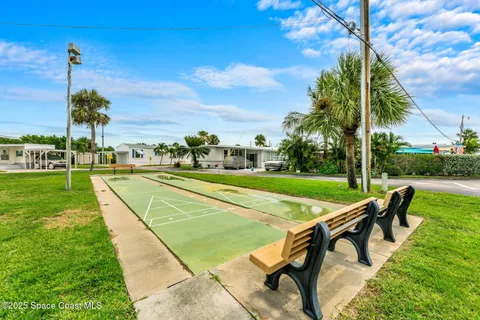 a view of a chairs and table in backyard