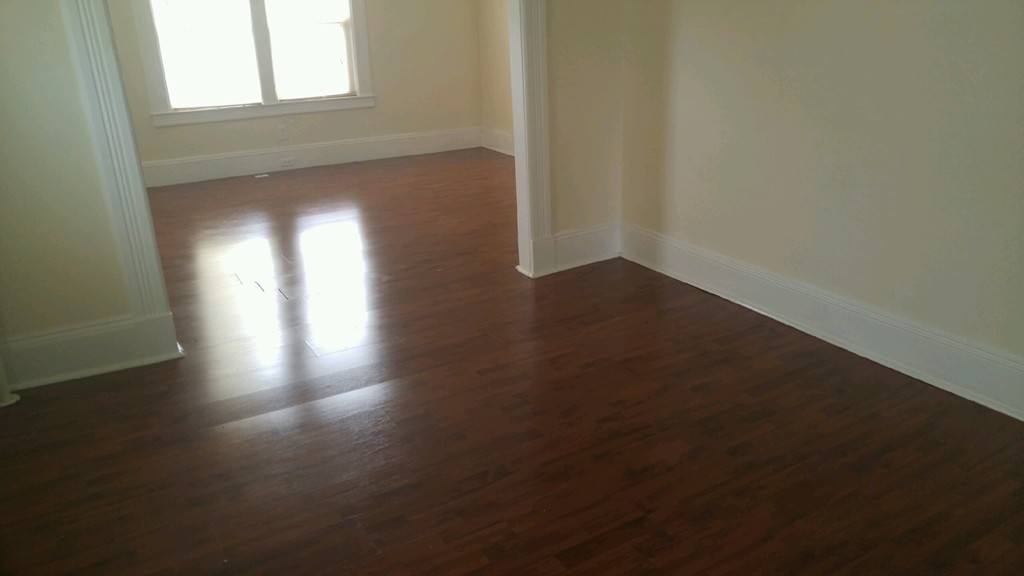 48 Bevier Street Springfield, MA 01107 - Photo 6 of 12 a view of an empty room with wooden floor and a window