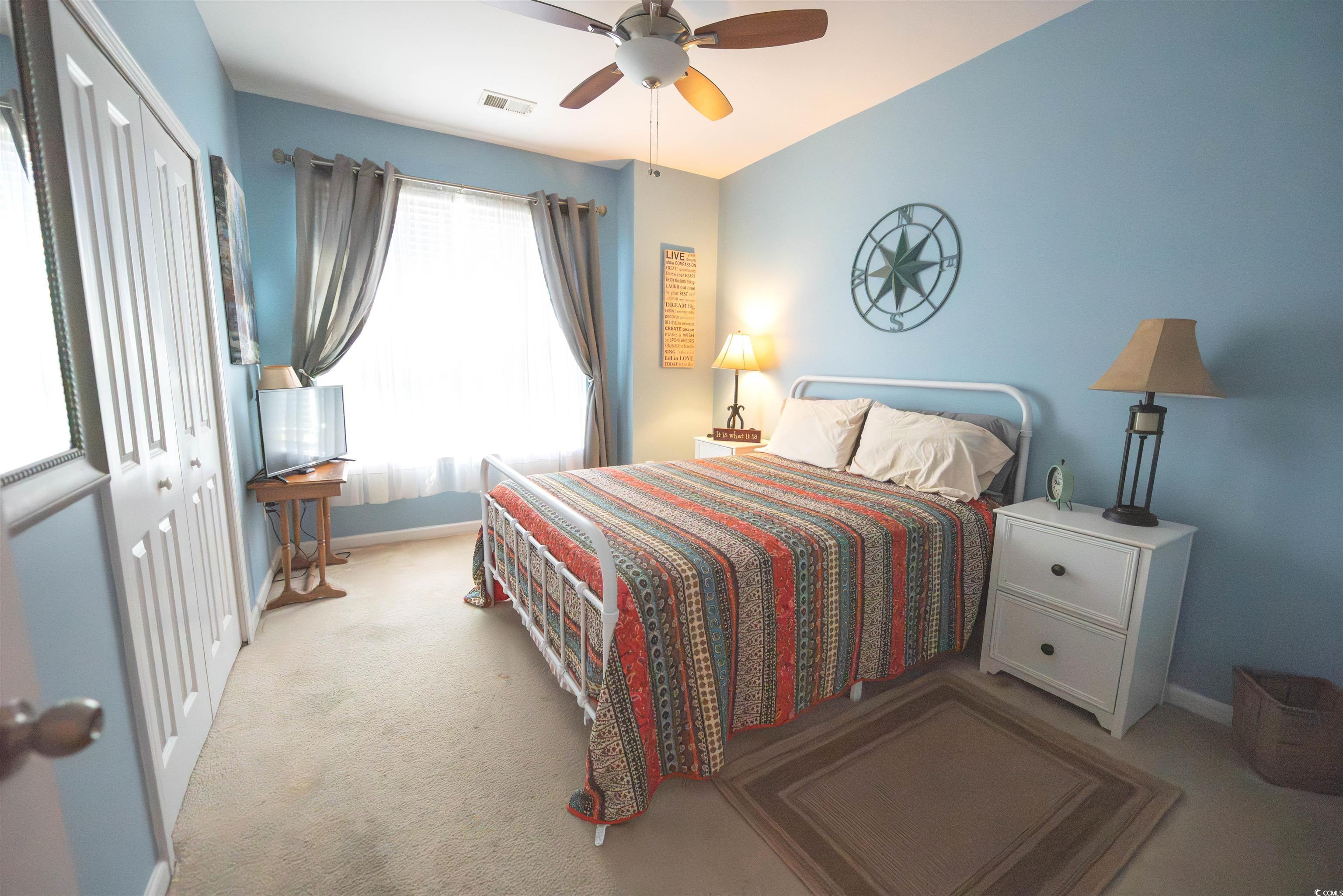 209 Golden Oaks Drive Murrells Inlet, SC 29576 - Photo 9 of 40 Carpeted bedroom featuring a closet and a ceiling fan