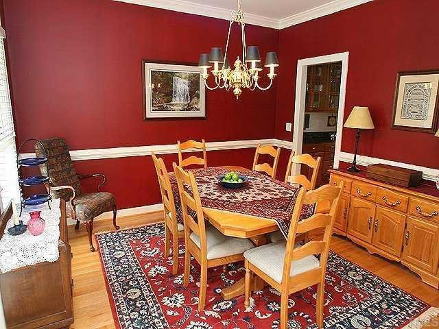 2329 Primrose Valley Court Raleigh, NC 27613 - Photo 3 of 12 The formal dining room has hardwoods, chair railing, and crown molding. Dining Room