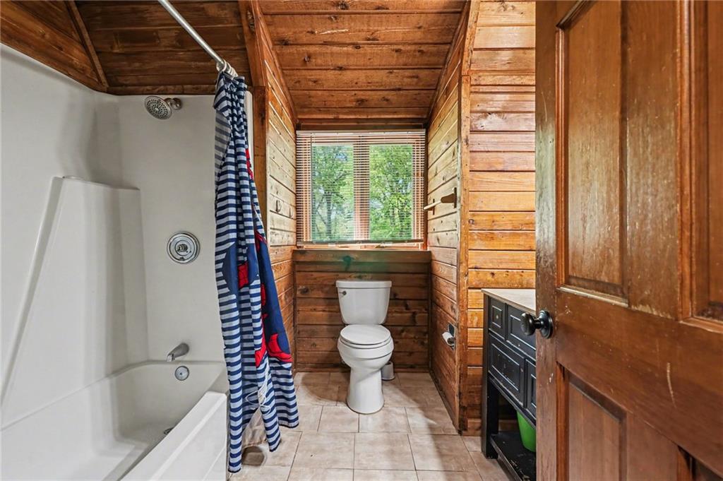 2530 Rockbridge Road Northwest Conyers, GA 30012 - Photo 16 of 45 a bathroom with a toilet and a shower