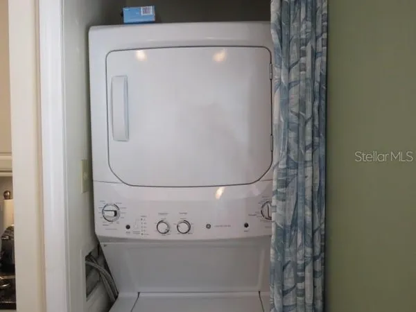 a close up view of a utility room with washer and dryer