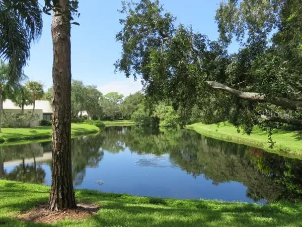 a view of lake with green space