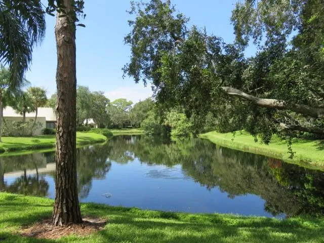 a view of lake with green space
