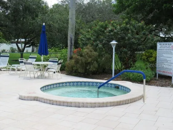 a view of a swimming pool with a patio