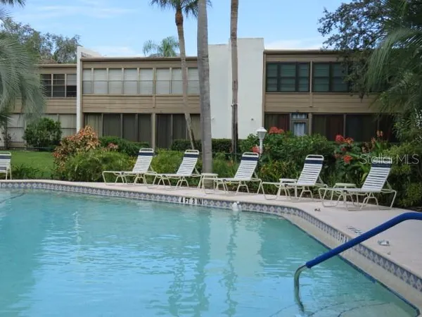 a view of a swimming pool with a patio