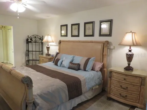 a bedroom with a bed and a lamp