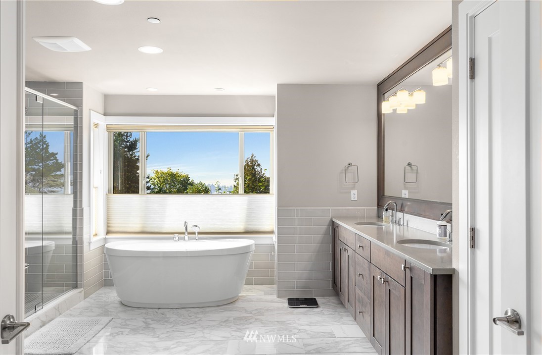 10406 Northeast 52nd Street Kirkland, WA 98033 - Photo 19 of 36 a room with a sink and a mirror