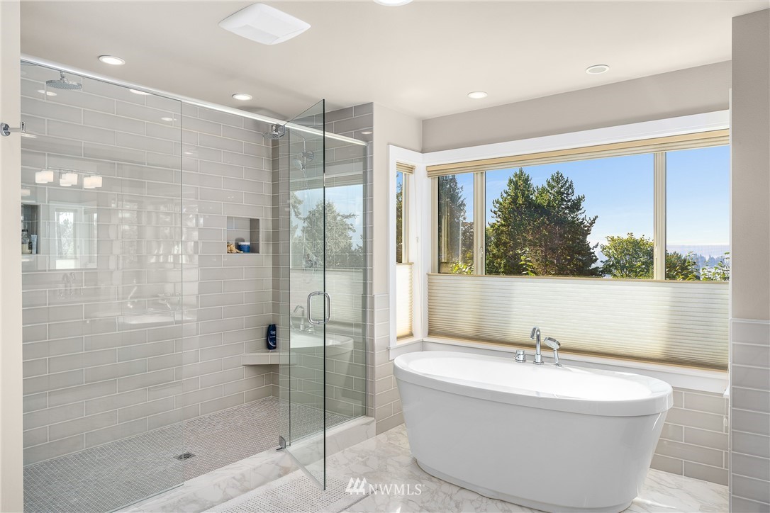 10406 Northeast 52nd Street Kirkland, WA 98033 - Photo 20 of 36 a bathroom with a bathtub and shower