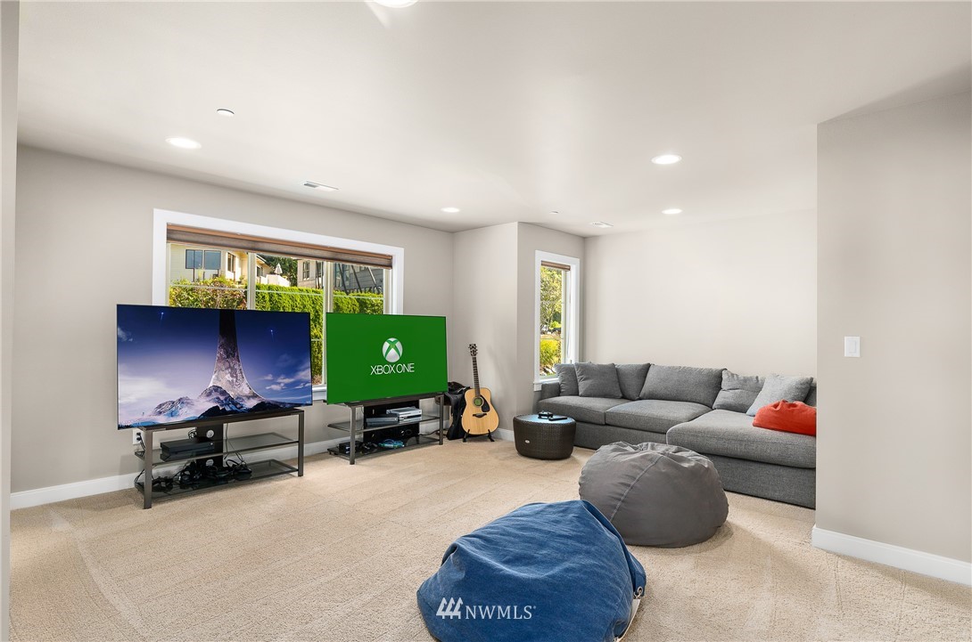 10406 Northeast 52nd Street Kirkland, WA 98033 - Photo 24 of 36 a living room with furniture and a window