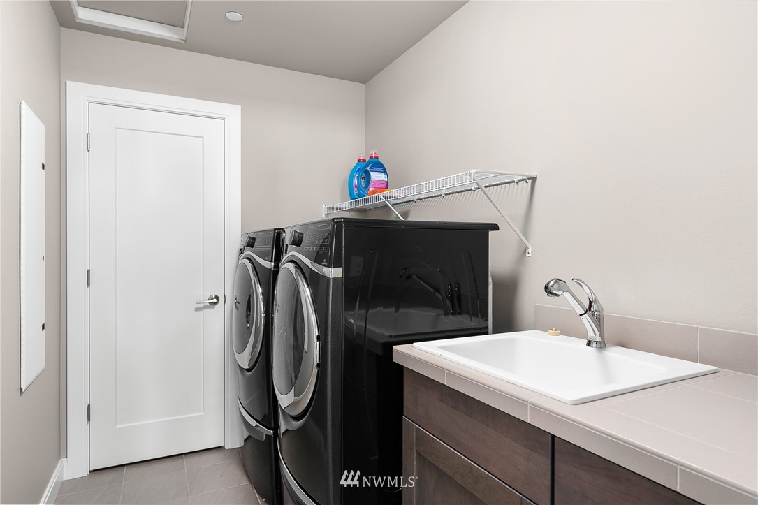 10406 Northeast 52nd Street Kirkland, WA 98033 - Photo 26 of 36 a utility room with dryer and washer