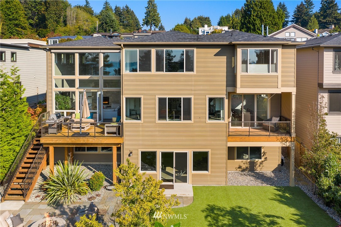 10406 Northeast 52nd Street Kirkland, WA 98033 - Photo 34 of 36 a front view of a house with a yard balcony