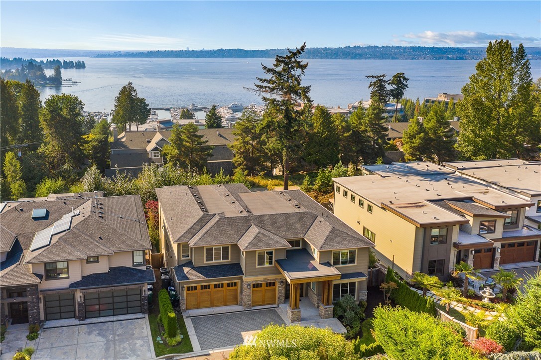 10406 Northeast 52nd Street Kirkland, WA 98033 - Photo 36 of 36 an aerial view of a house with a garden and lake view