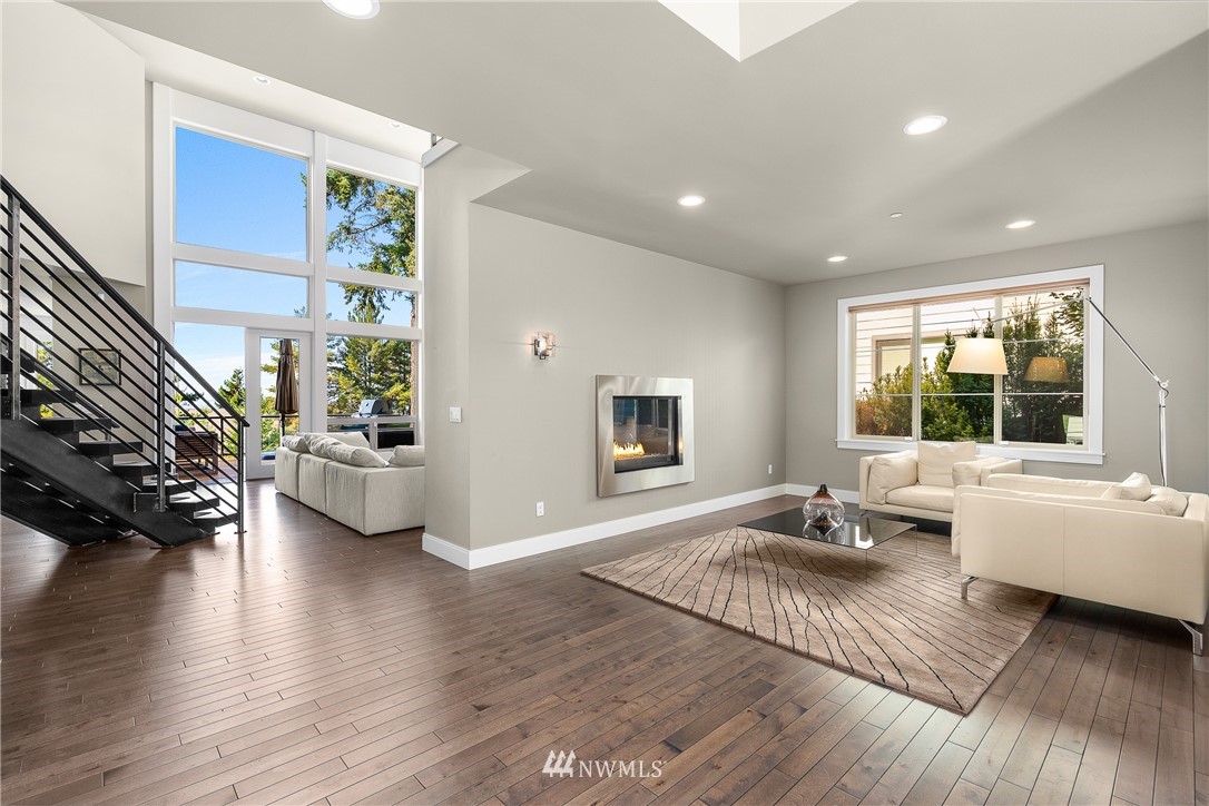 10406 Northeast 52nd Street Kirkland, WA 98033 - Photo 5 of 36 a living room with furniture window and a wooden floor