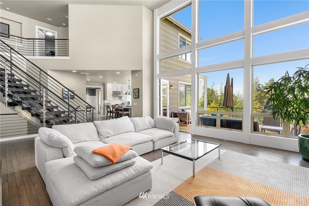 10406 Northeast 52nd Street Kirkland, WA 98033 - Photo 7 of 36 a living room with furniture and a large window