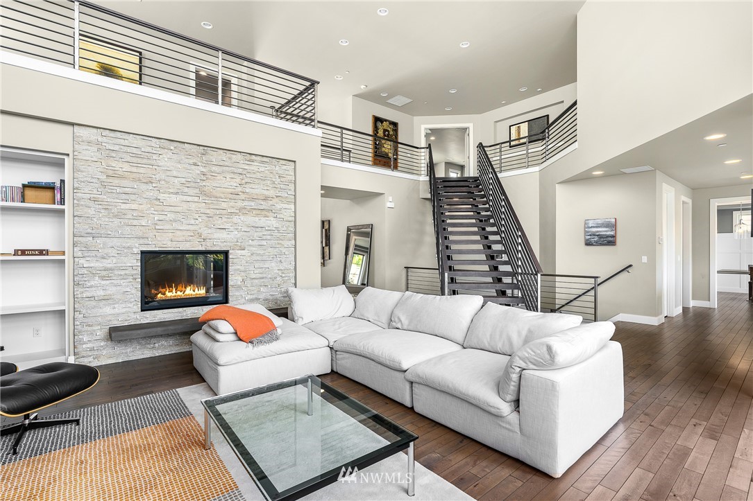 10406 Northeast 52nd Street Kirkland, WA 98033 - Photo 8 of 36 a living room with furniture and a fireplace